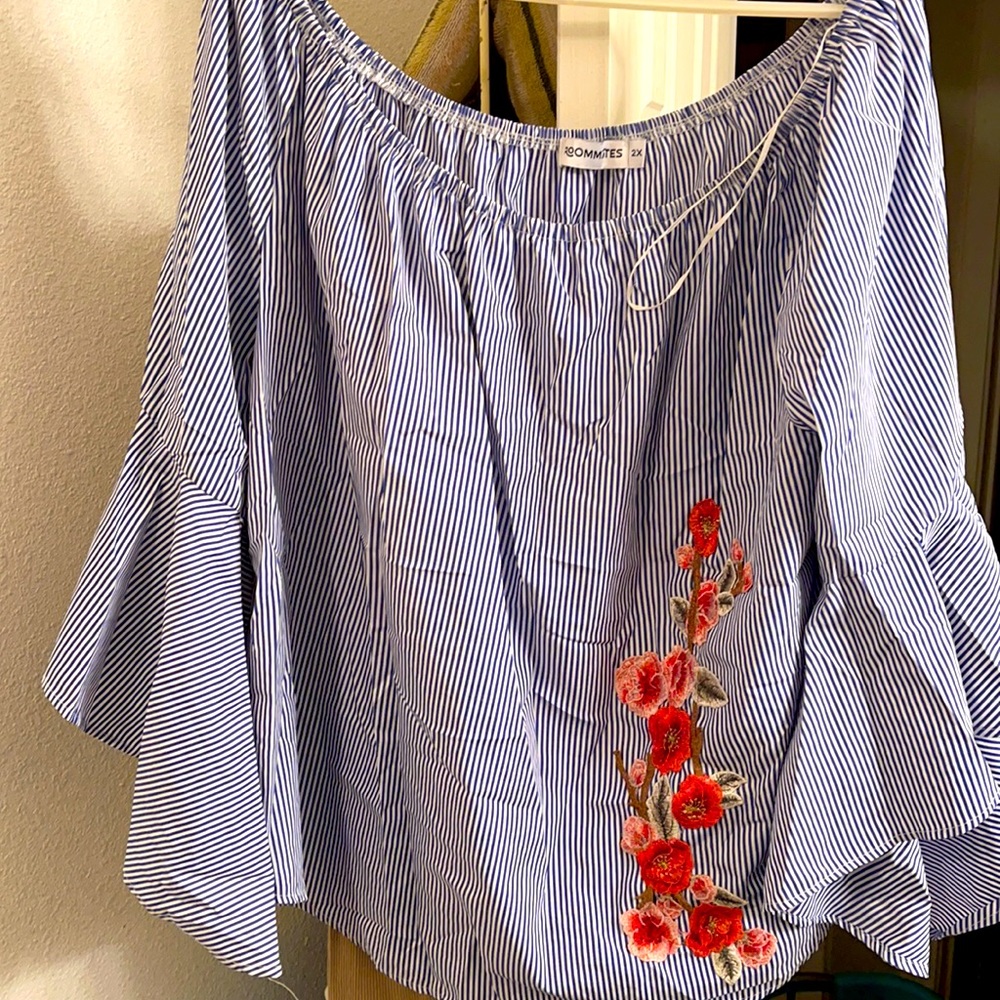 Striped blue and white blouse with floral design